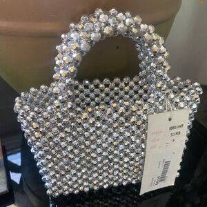 Silver rhinestone purse .